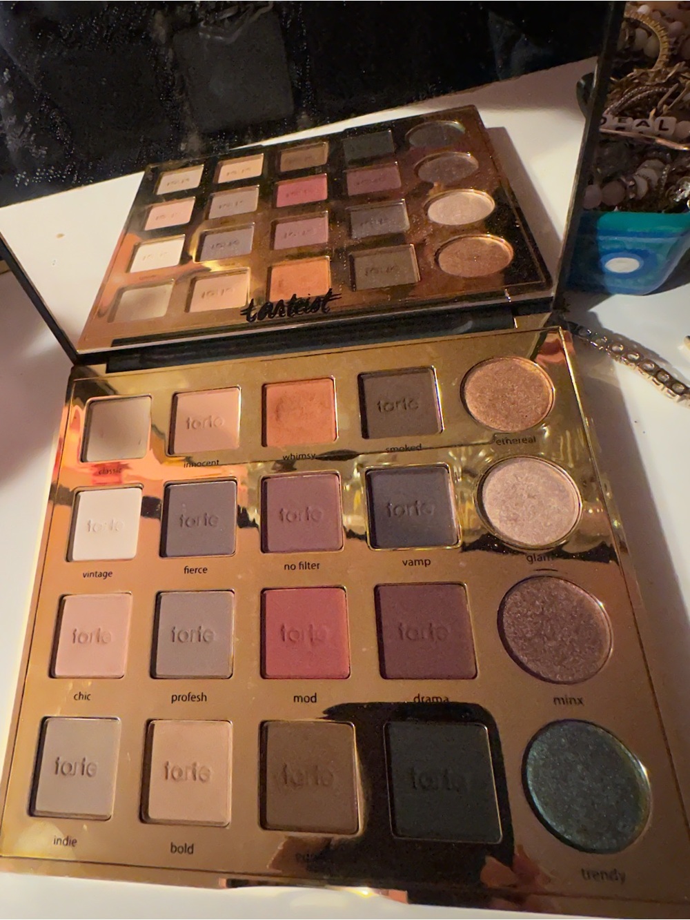 tarte Eyeshadow Palette — Shades of mauve, bronze, plum, cream, taupe, and gold